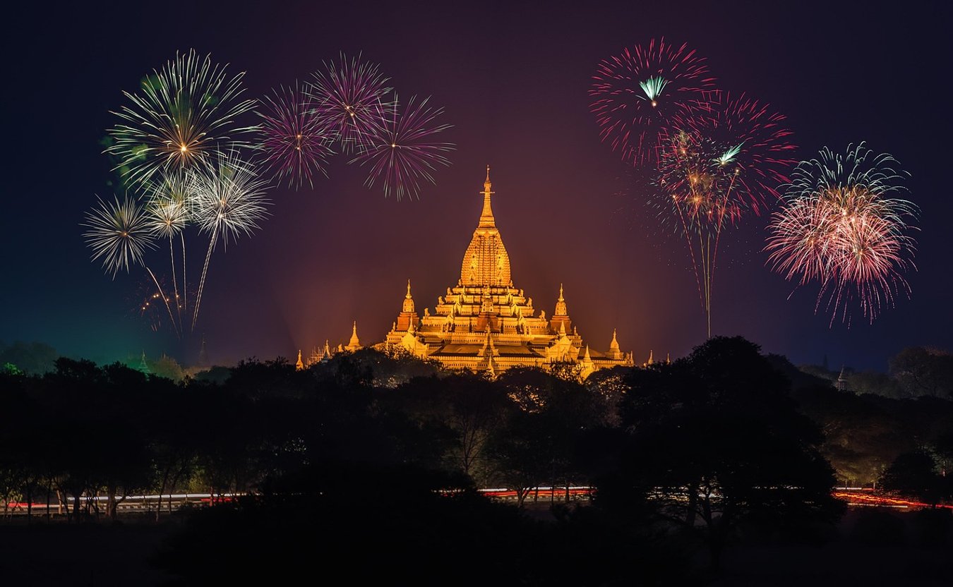 Fireworks burst over the golden spire of Ananda Temple in Bagan at night.